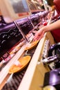 Woman`s hand taking plate of sushi